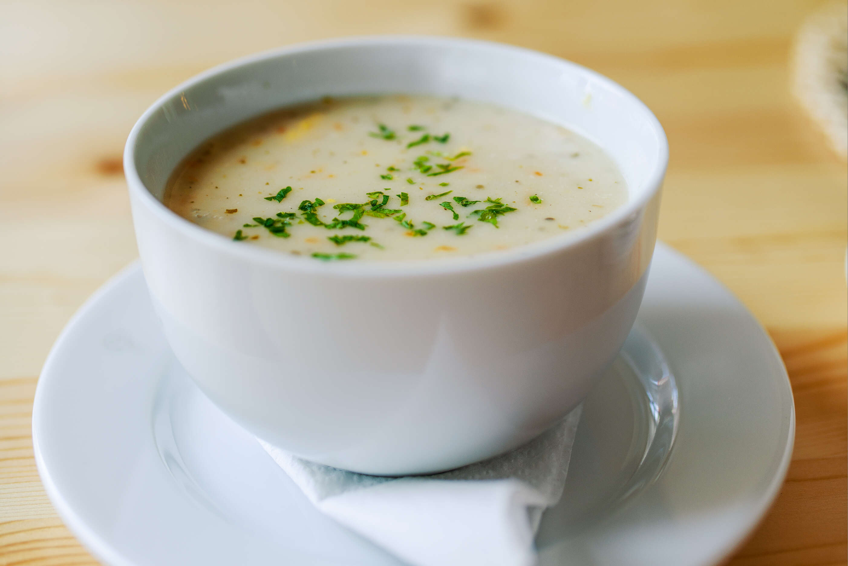 Creamy soup at table
