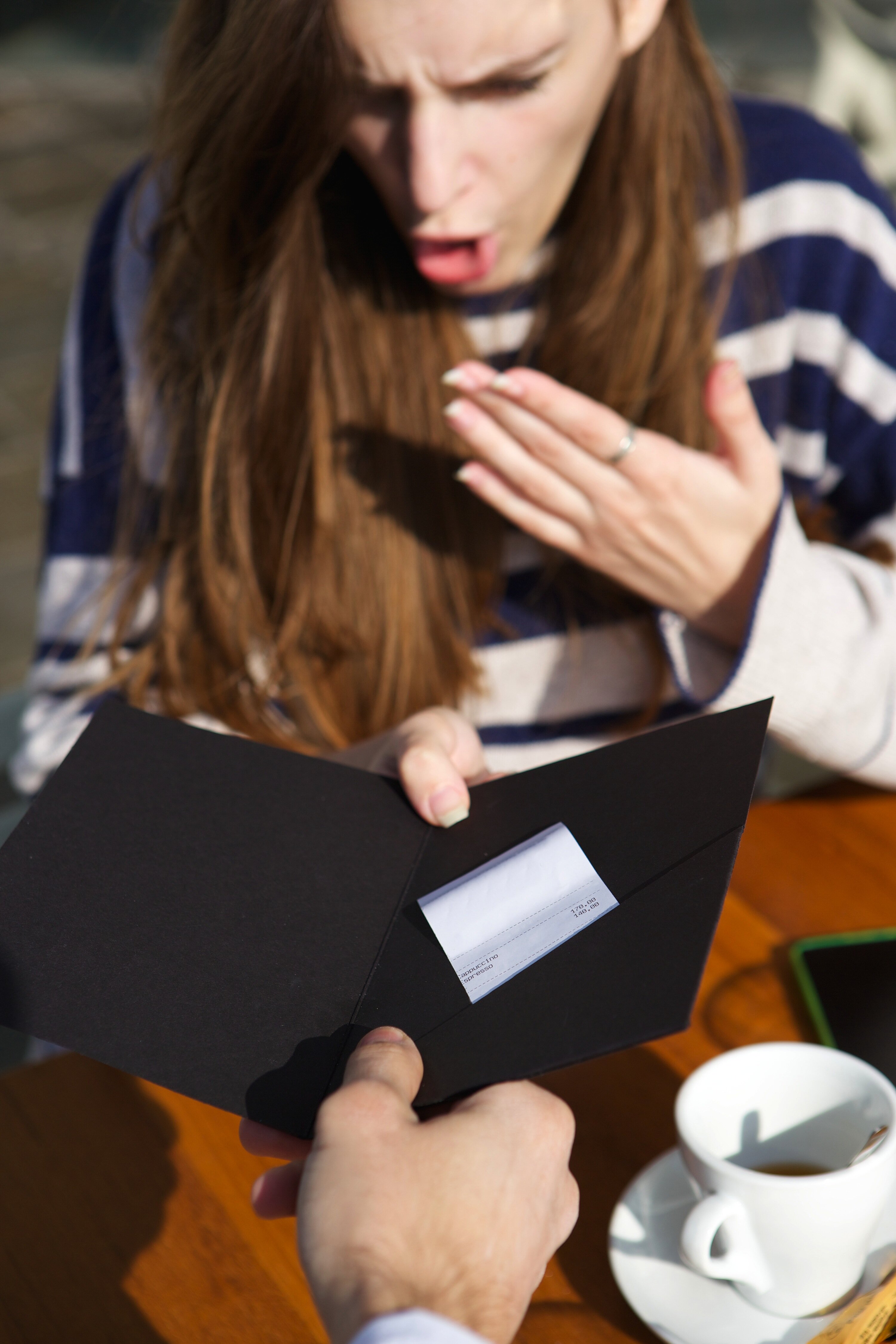 Woman shocked at check