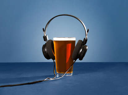 beer pint with headphones on