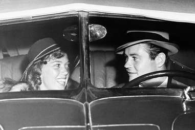 Vintage photo of couple sitting in car
