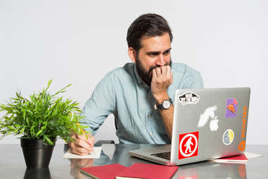 man stressed on computer