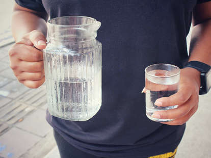 Man holding water cup