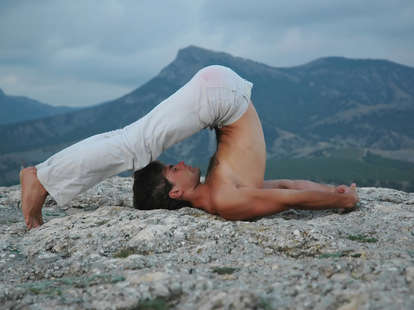 man practicing yoga