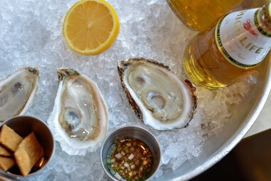 Oysters and Miller High Life from One Eared Stag