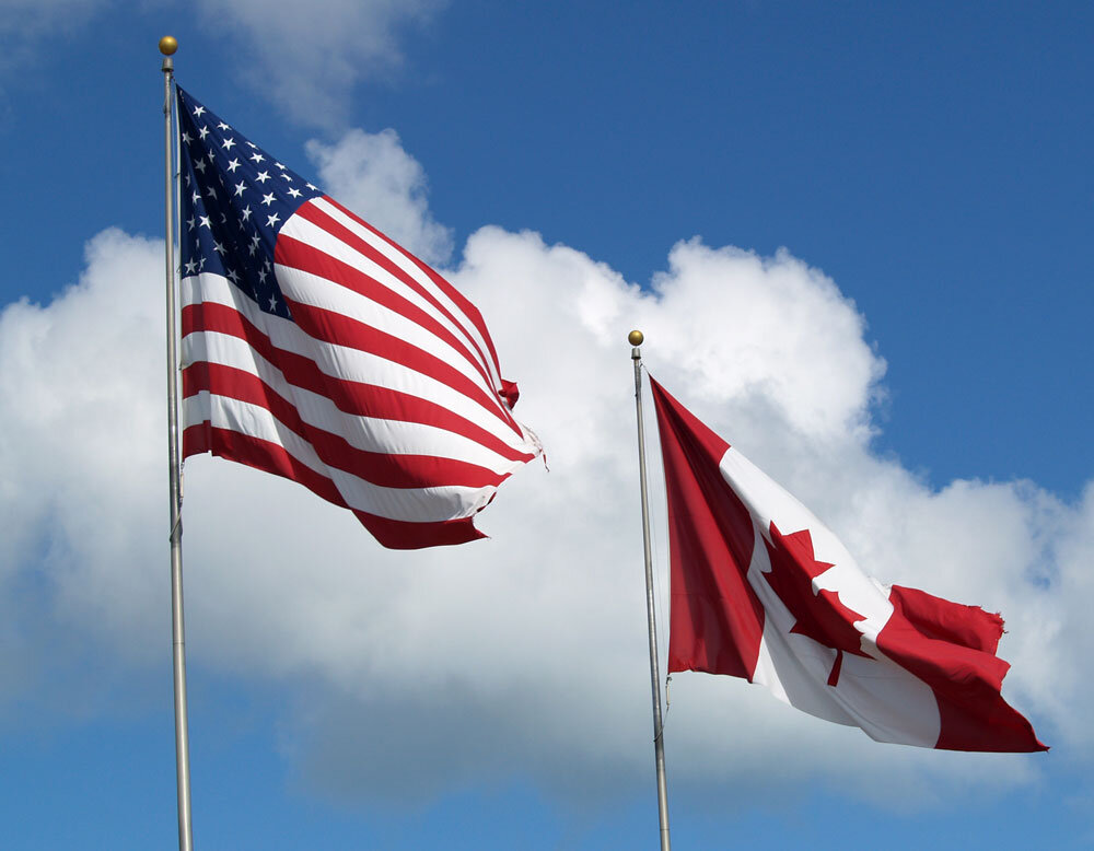 American and Canadian flags