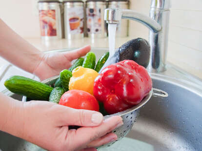 Person washing vegetable