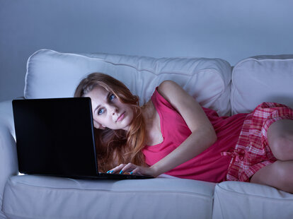 woman on computer at night