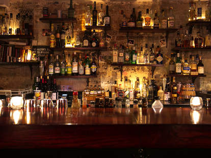 happiness forgets london thrillist long bar bottles on shelves