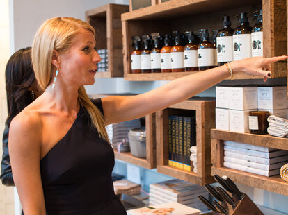 Gwyneth Paltrow pointing for Goop