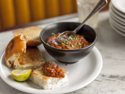 Dishoom indian sauce and bread on plate thrillist london