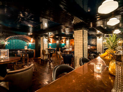 HAWKSMOOR restaurant interior bar and tables thrillist london