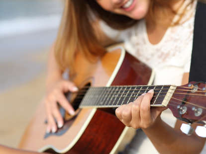 woman playing a guitar