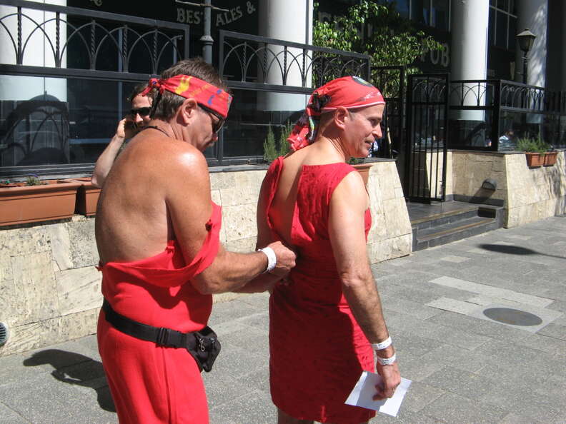 men in red dresses