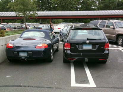 Parking over the lines