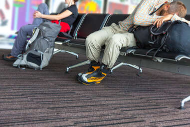 Backpacker resting in airport