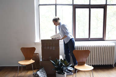 woman unpacking apartment