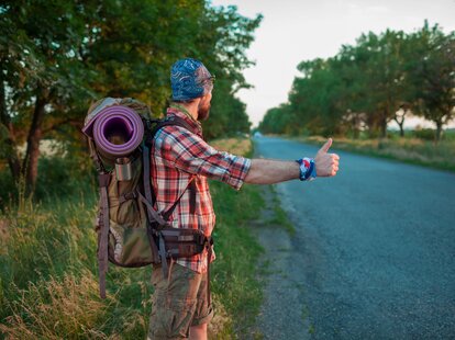 man hitchhiking in europe
