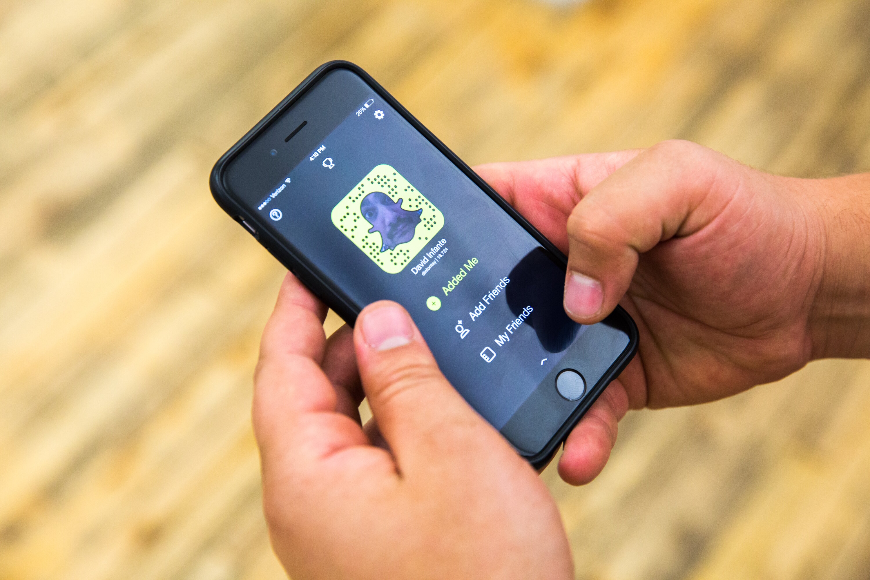 man on snapchat on iphone