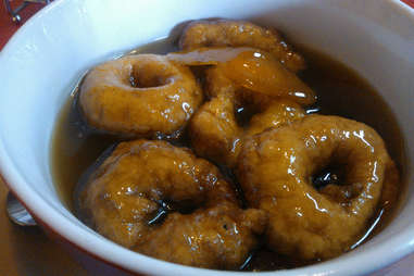 Picarones soaking in syrup