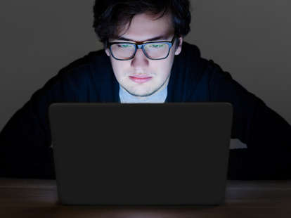 guy with glasses looking at screen