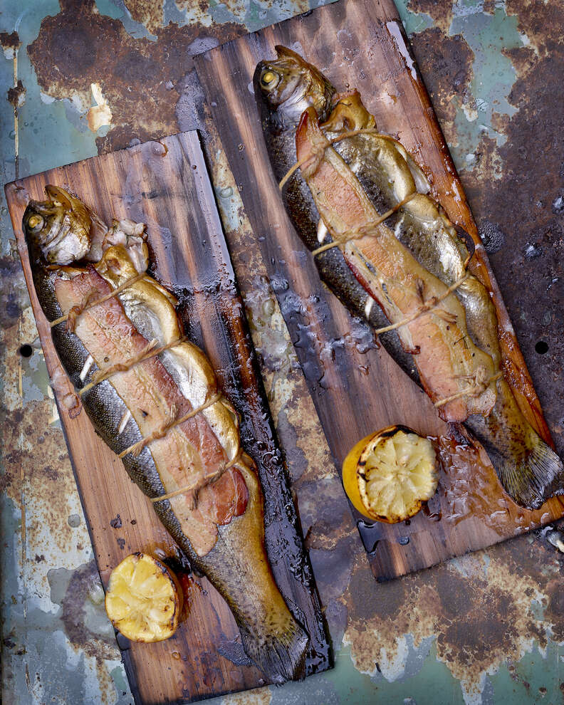 smoked whole fish on a wood plank