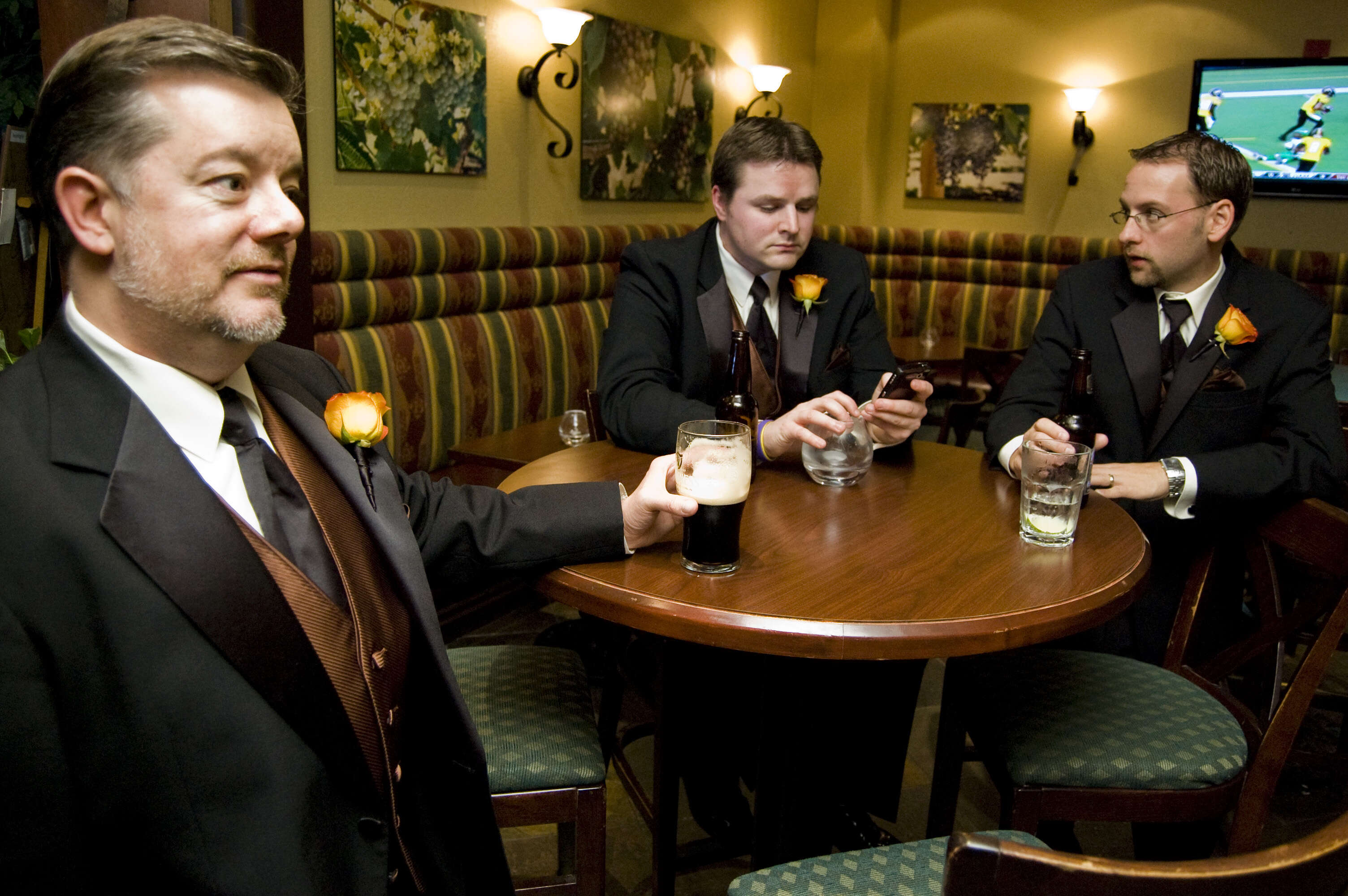 Groomsmen drink before a wedding 