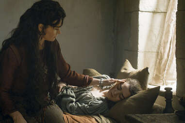 Essie Davis as Lady Crane nursing Maisie Williams as Arya Stark back to health