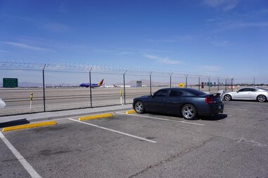 Car watching plane traffic