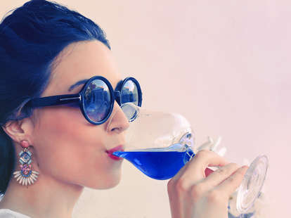 Girl Drinking Blue Wine