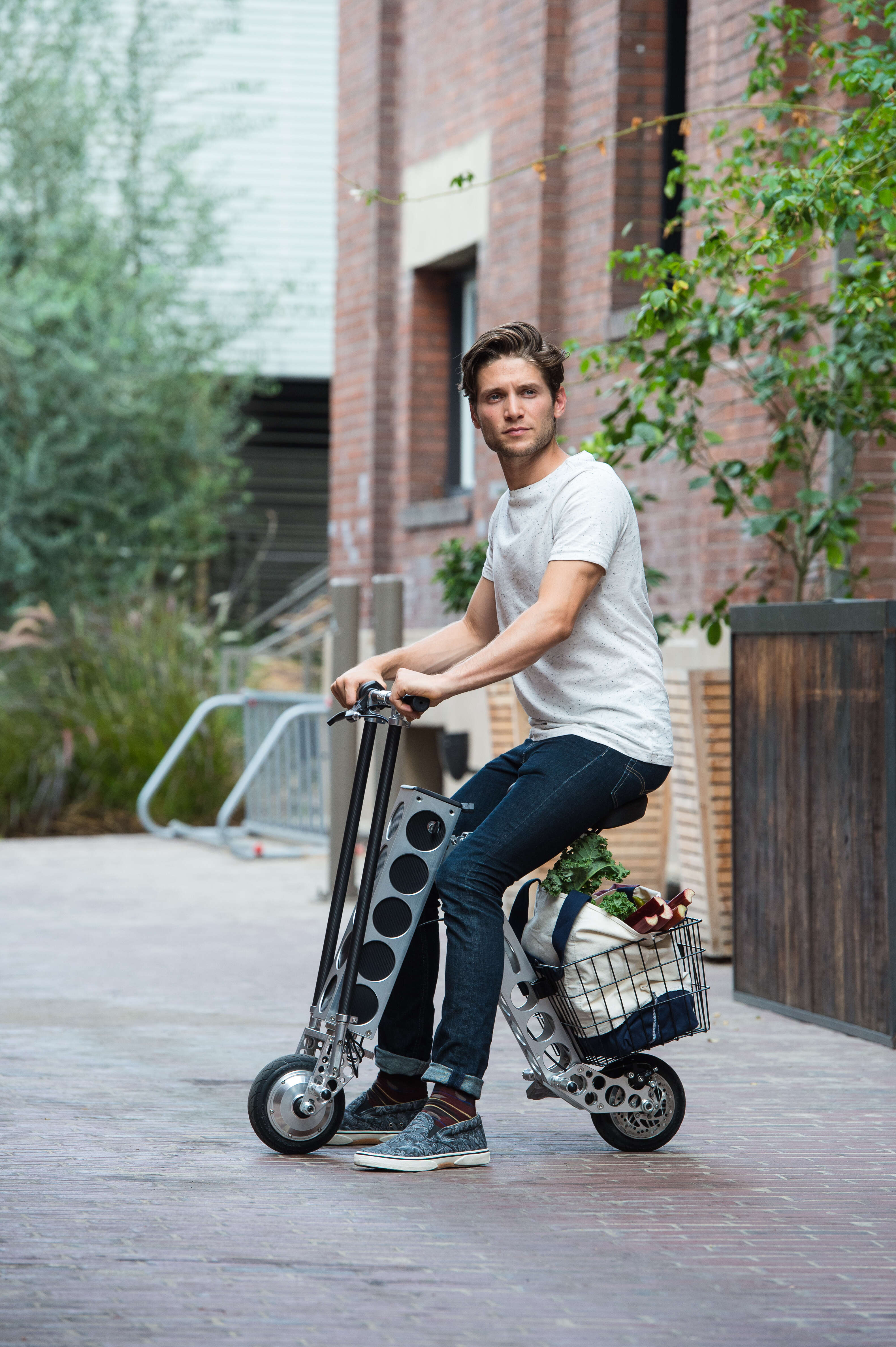 man riding Urb-E electric scooter