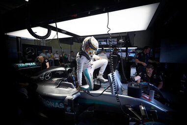 Lewis Hamilton climbs out of his car