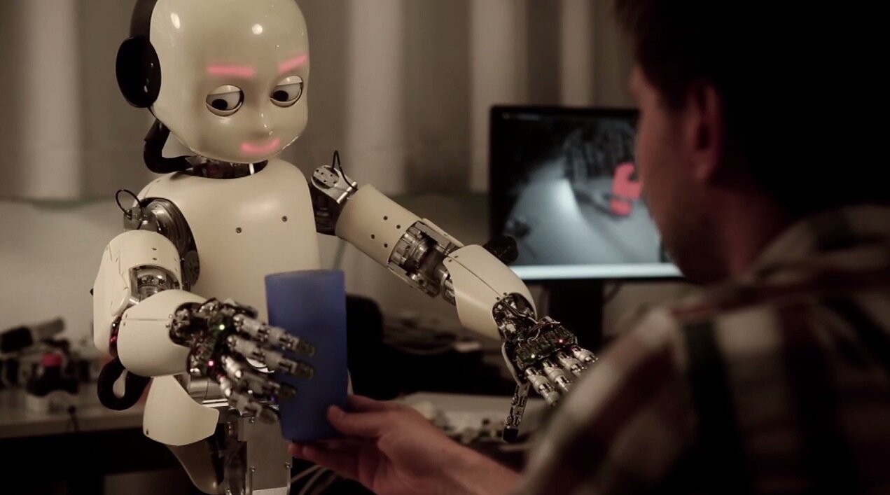 small robot holding a cup