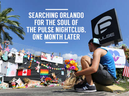 a friend of two victims places flowers in front of Pulse
