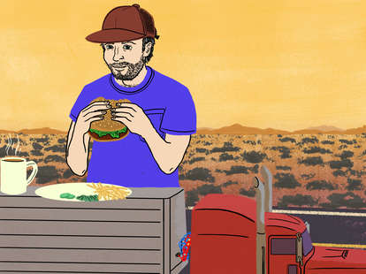 Truckers eating food a giant truck