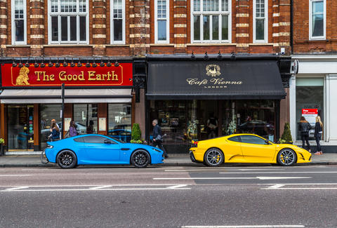 A Blue Aston Martin and Yellow Lexus