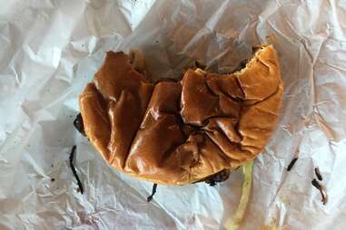 Tucker’s Onion Burgers Half Eaten Burger