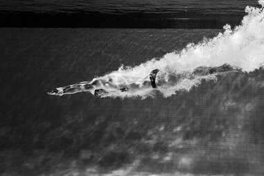 Olympic swimmer diving into pool