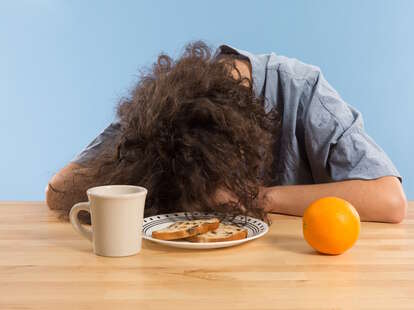 Woman asleep on the table