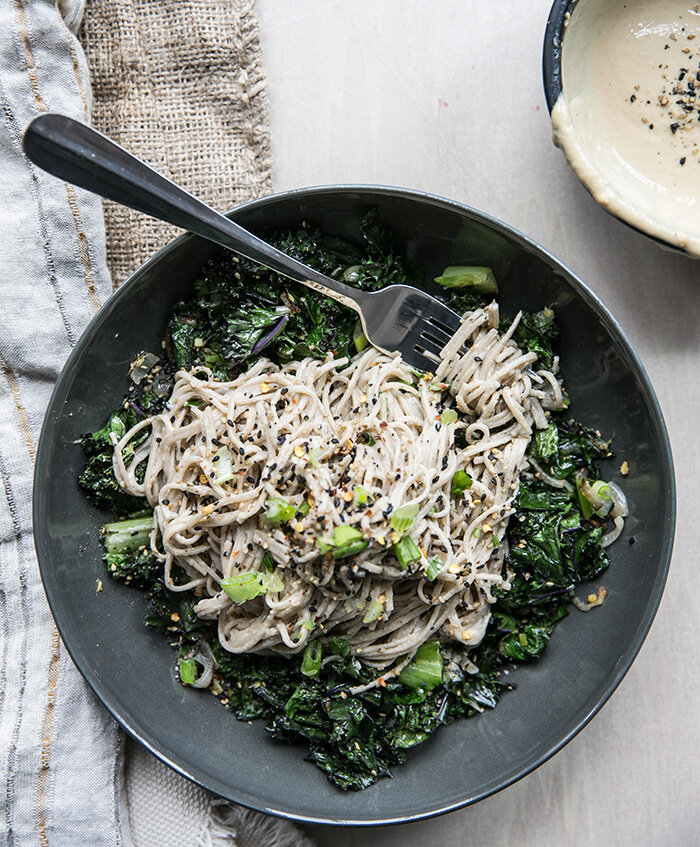 Soba noodles and ginger tahini with crispy kale, shallots, and romaine