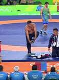 Olympic Wrestling Coach Angrily Strips Down in Front of Judges