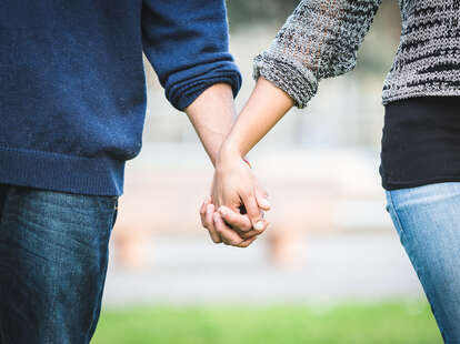 interracial couple holding hands and dating