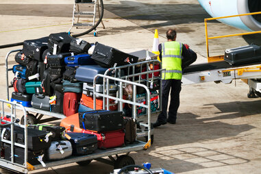loading baggage on a plane
