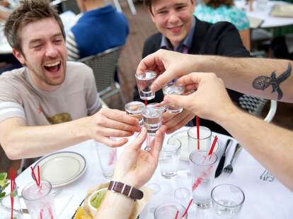 friends taking shot cheers