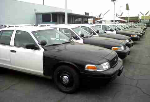Using Police Car For Cover How to Buy Used Police Cars: Tips & Tricks for Cop Auctions - Thrillist