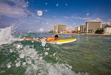 The Best Beaches in Hawaii for Learning How to Surf, According to Pro Surfers