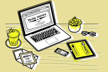 Laptop with invite on a desk