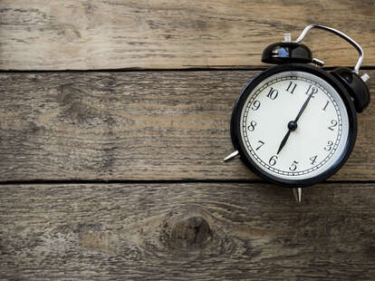Clock on wooden background
