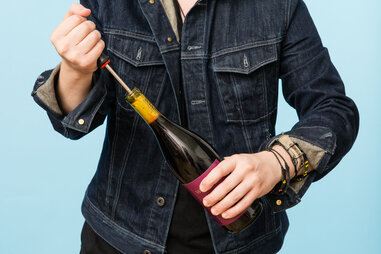 Opening a wine bottle