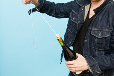 Opening a wine bottle
