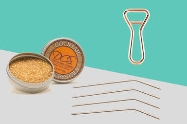 Metal straws, gold cocktail sugar, and copper bottle opener